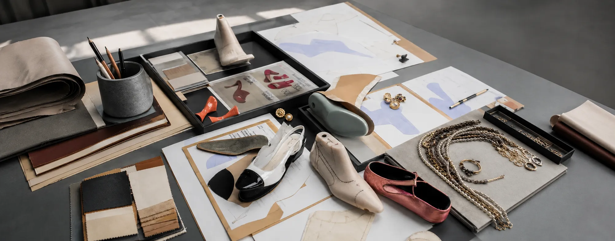 Footwear and bag development materials arranged for a commercial launch